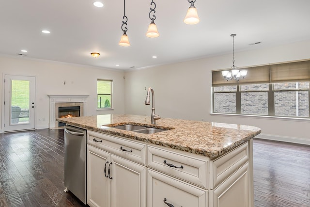 76 Molly Bright Ln, Franklin, TN 37064 - kitchen with stainless steel dishwasher, a kitchen island with sink, ornamental molding, open floor plan, and dark wood-type flooring