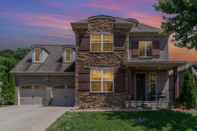 76 Molly Bright Ln, Franklin, TN 37064 - french country style house with a garage, driveway, brick siding, and stone siding