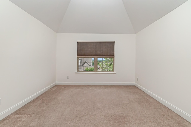 76 Molly Bright Ln, Franklin, TN 37064 - empty room featuring lofted ceiling and light carpet