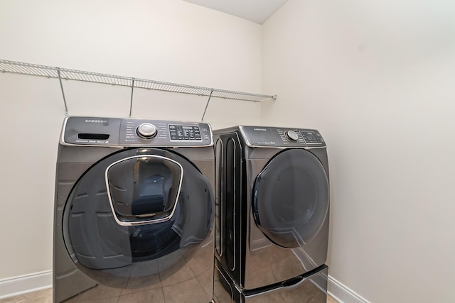76 Molly Bright Ln, Franklin, TN 37064 - washroom with washer and dryer and light tile patterned flooring