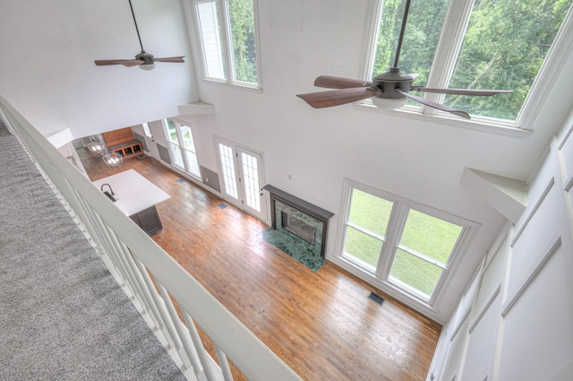 1202 Willow Brook Pass, Mount Juliet, TN 37122 - living room with a ceiling fan, a high ceiling, wood finished floors, and a high end fireplace