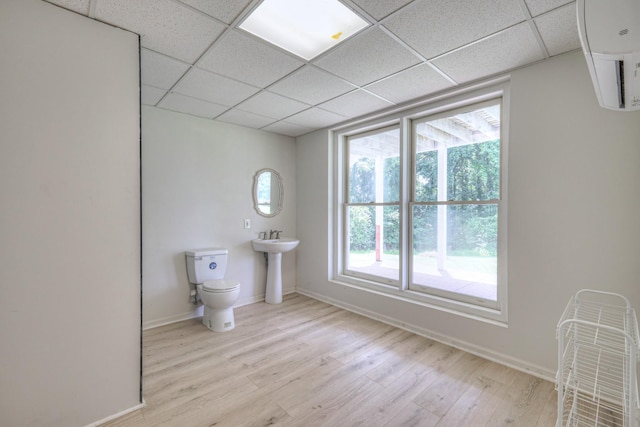 1202 Willow Brook Pass, Mount Juliet, TN 37122 - bathroom featuring wood finished floors, a drop ceiling, and an AC wall unit