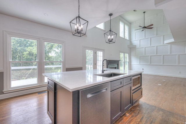 1202 Willow Brook Pass, Mount Juliet, TN 37122 - kitchen with stainless steel appliances, open floor plan, hanging light fixtures, a chandelier, and wood finished floors