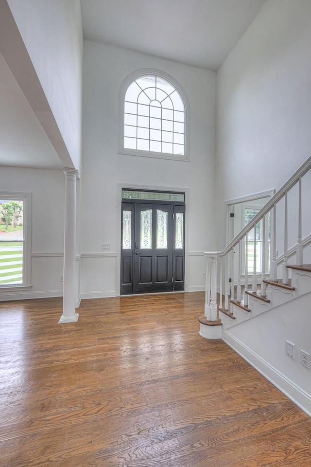 1202 Willow Brook Pass, Mount Juliet, TN 37122 - entrance foyer featuring ornate columns, a towering ceiling, stairs, and wood finished floors