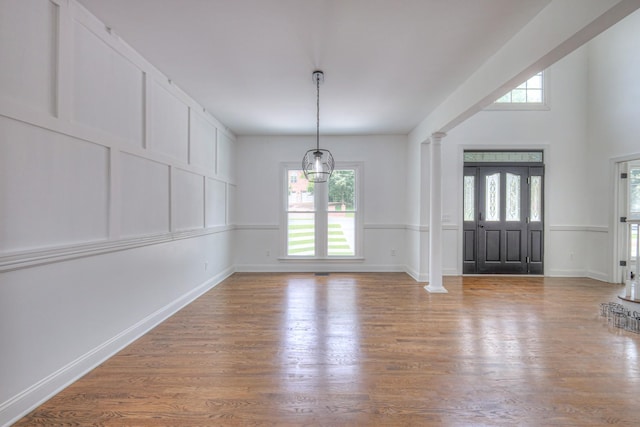 1202 Willow Brook Pass, Mount Juliet, TN 37122 - entrance foyer with plenty of natural light, decorative columns, and wood finished floors