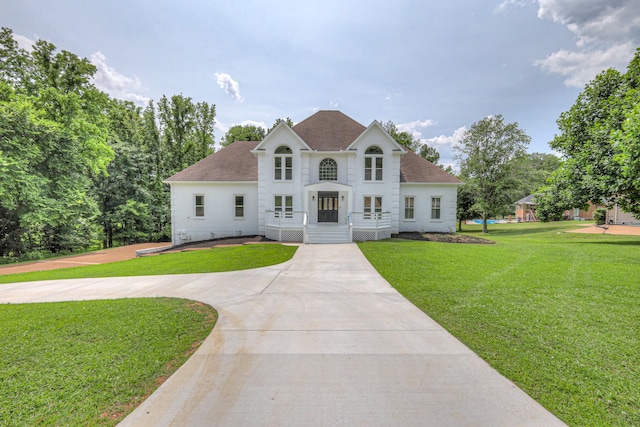 1202 Willow Brook Pass, Mount Juliet, TN 37122 - colonial home featuring a shingled roof, a front lawn, and curved driveway