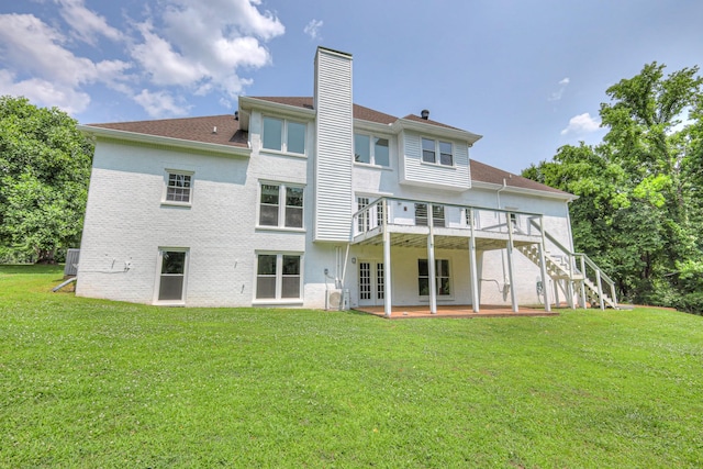 1202 Willow Brook Pass, Mount Juliet, TN 37122 - back of property with a chimney, stairway, a lawn, and a wooden deck