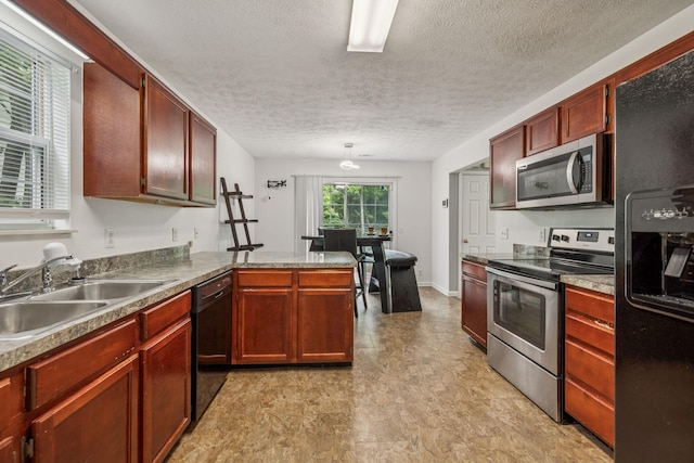 3524 Glenfalls Dr, Hermitage, TN 37076 - kitchen with black appliances, light flooring, a peninsula, and a textured ceiling
