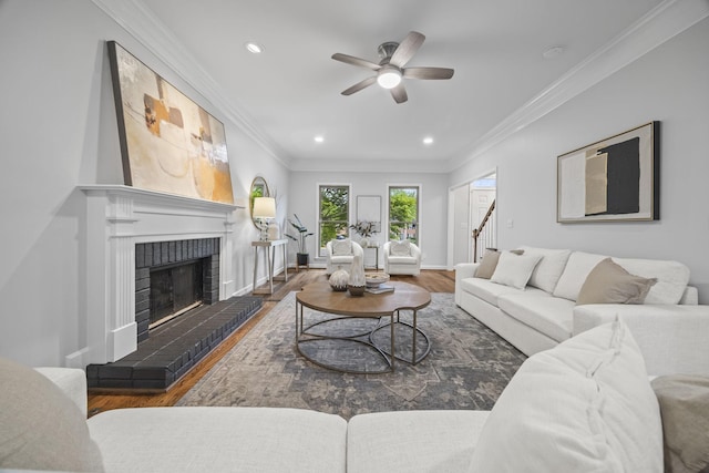 1183 Buckingham Cir, Franklin, TN 37064 - living room with ceiling fan, wood finished floors, a fireplace, ornamental molding, and recessed lighting