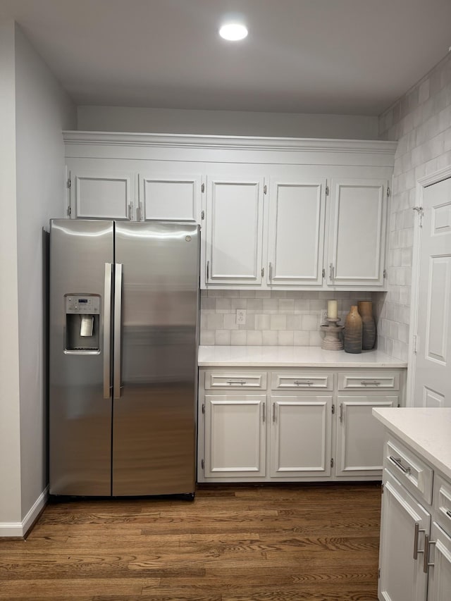 1183 Buckingham Cir, Franklin, TN 37064 - kitchen with stainless steel refrigerator with ice dispenser, white cabinetry, light countertops, backsplash, and recessed lighting