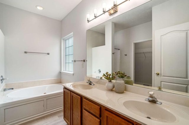 77 Kendall Park Dr, Nashville, TN 37217 - full bath with a garden tub, double vanity, wood finished floors, and a walk in closet
