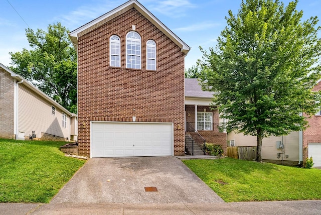 77 Kendall Park Dr, Nashville, TN 37217 - traditional home with brick siding, asphalt driveway, an attached garage, and a front yard