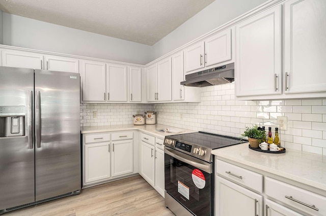 77 Kendall Park Dr, Nashville, TN 37217 - kitchen with appliances with stainless steel finishes, under cabinet range hood, white cabinets, and light wood-type flooring