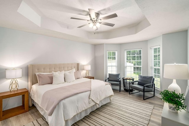 77 Kendall Park Dr, Nashville, TN 37217 - bedroom with a raised ceiling, light wood finished floors, and ceiling fan
