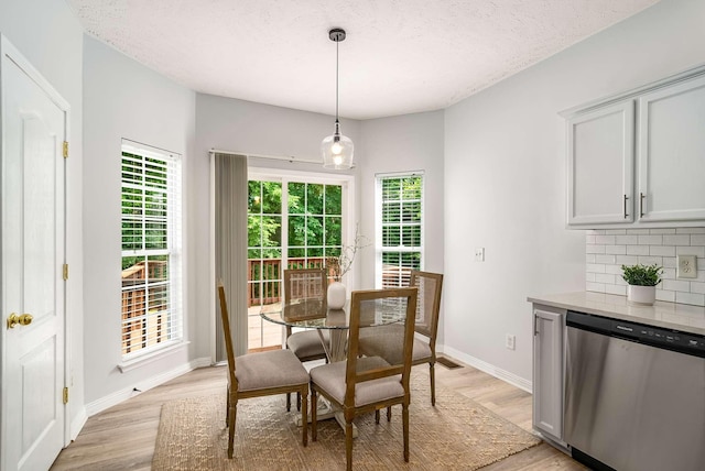 77 Kendall Park Dr, Nashville, TN 37217 - dining space with light wood finished floors, plenty of natural light, and a textured ceiling
