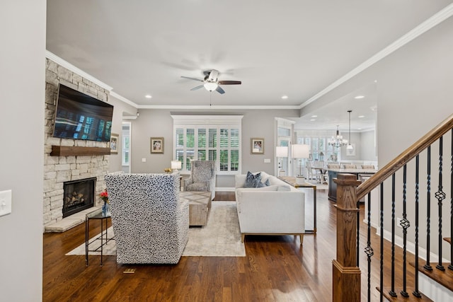 1120 Pretender Way, Columbia, TN 38401 - living room with dark wood-style flooring, a ceiling fan, a stone fireplace, ornamental molding, and recessed lighting