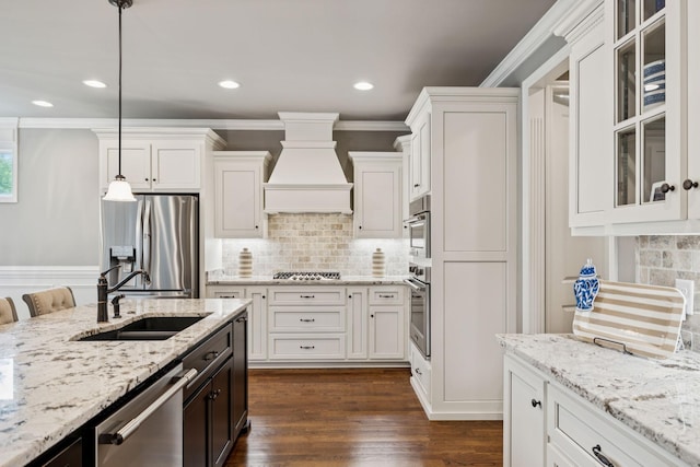 1120 Pretender Way, Columbia, TN 38401 - kitchen with stainless steel appliances, custom exhaust hood, white cabinets, crown molding, and recessed lighting