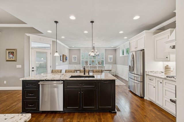 1120 Pretender Way, Columbia, TN 38401 - kitchen featuring stainless steel appliances, white cabinets, a center island with sink, crown molding, and light stone counters