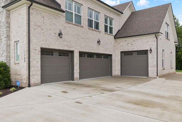 1120 Pretender Way, Columbia, TN 38401 - view of property exterior featuring brick siding, driveway, and a garage