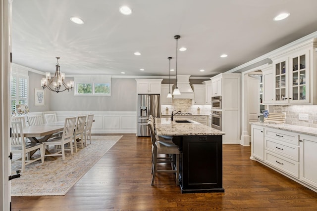 1120 Pretender Way, Columbia, TN 38401 - kitchen featuring stainless steel appliances, crown molding, premium range hood, white cabinetry, and a chandelier