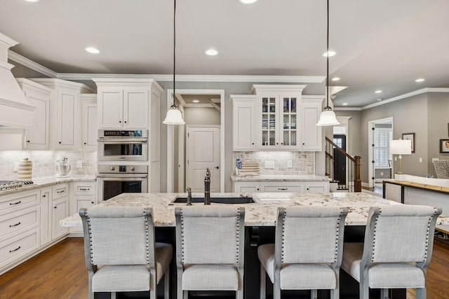 1120 Pretender Way, Columbia, TN 38401 - kitchen featuring stainless steel appliances, white cabinets, decorative backsplash, glass insert cabinets, and recessed lighting