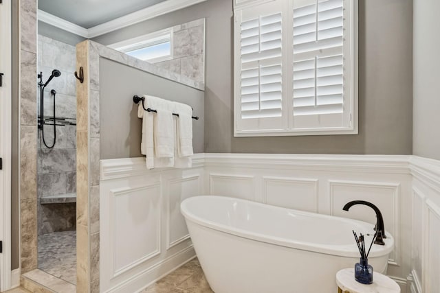 1120 Pretender Way, Columbia, TN 38401 - full bathroom with a decorative wall, a soaking tub, a walk in shower, crown molding, and a wainscoted wall