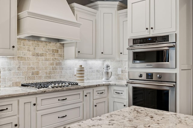 1120 Pretender Way, Columbia, TN 38401 - kitchen featuring custom exhaust hood, appliances with stainless steel finishes, white cabinets, and backsplash