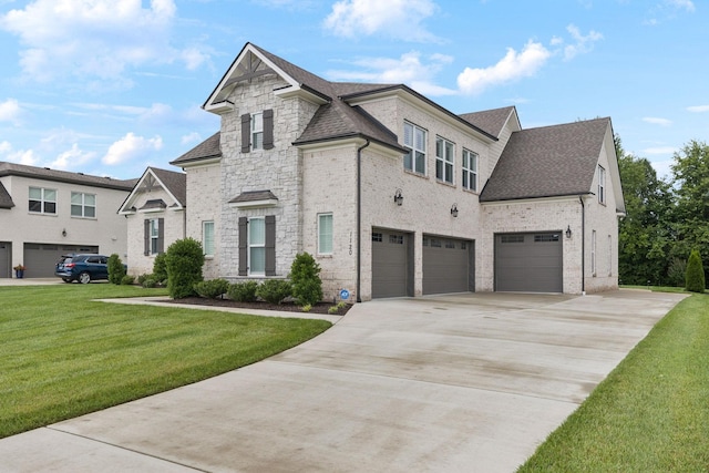 1120 Pretender Way, Columbia, TN 38401 - french provincial home with concrete driveway, a front yard, roof with shingles, and stone siding