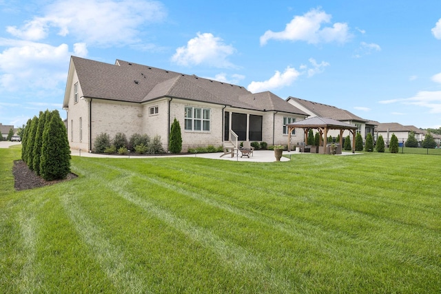 1120 Pretender Way, Columbia, TN 38401 - rear view of house featuring a gazebo, a patio, a yard, brick siding, and roof with shingles