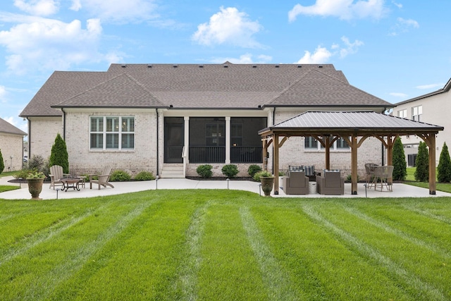1120 Pretender Way, Columbia, TN 38401 - rear view of house featuring a patio, brick siding, a gazebo, and a lawn