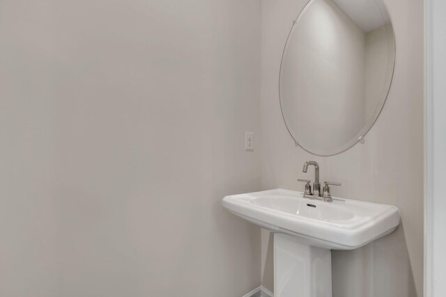 5211 Gladecress Ln, Hermitage, TN 37076 - bathroom featuring a sink and baseboards