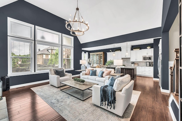 1229 Bobwhite Trl, Nolensville, TN 37135 - living room with a chandelier, high vaulted ceiling, plenty of natural light, and dark wood-style flooring
