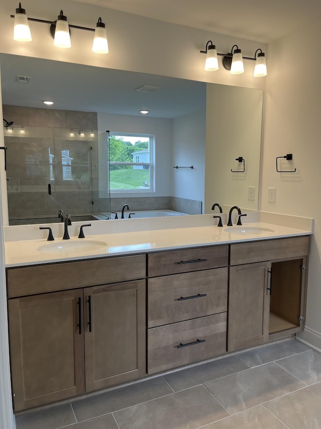 1559 Oak Springs Dr, Columbia, TN 38401 - full bathroom featuring double vanity, tile patterned floors, and a shower stall