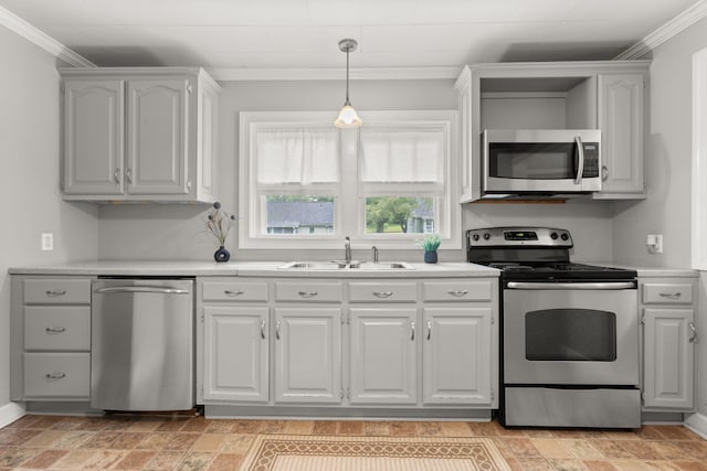 104 S Charlotte St, Dickson, TN 37055 - kitchen with stainless steel appliances, crown molding, light countertops, pendant lighting, and white cabinets