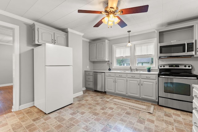 104 S Charlotte St, Dickson, TN 37055 - kitchen featuring stainless steel appliances, light countertops, ornamental molding, ceiling fan, and pendant lighting