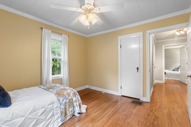 104 S Charlotte St, Dickson, TN 37055 - bedroom with light wood-style floors, ornamental molding, and ceiling fan