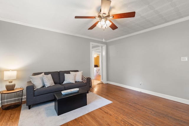104 S Charlotte St, Dickson, TN 37055 - living area featuring wood finished floors, a ceiling fan, and ornamental molding