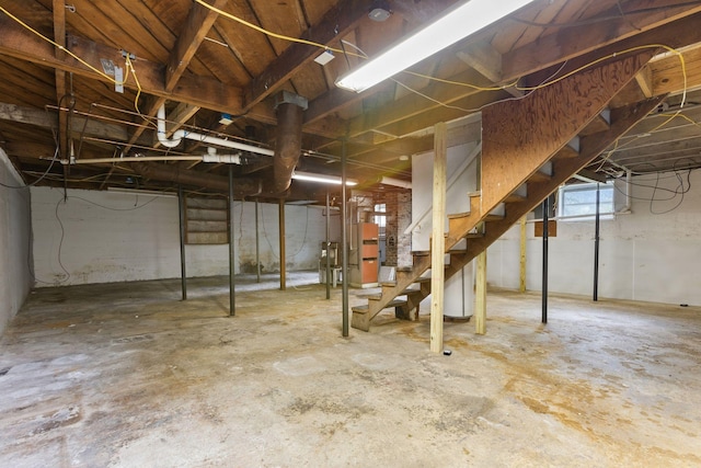 104 S Charlotte St, Dickson, TN 37055 - basement featuring stairs and water heater