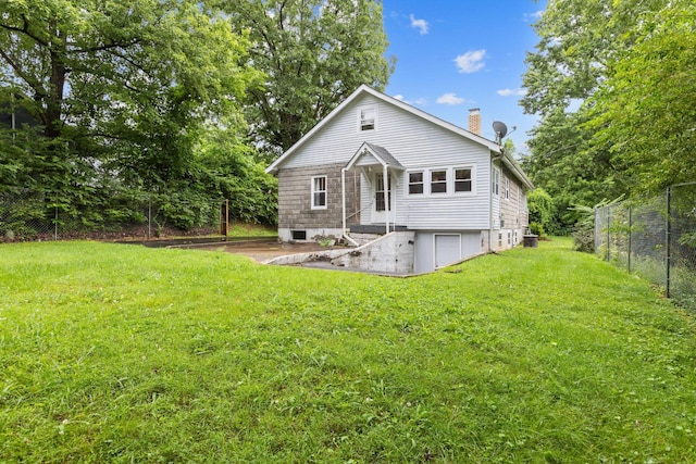 104 S Charlotte St, Dickson, TN 37055 - rear view of house with a chimney
