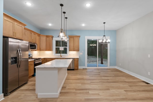4100 Asbury Rd, Manchester, TN 37355 - kitchen with appliances with stainless steel finishes, a chandelier, light wood-style floors, decorative light fixtures, and recessed lighting