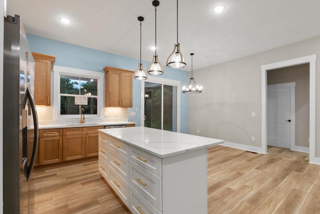 4100 Asbury Rd, Manchester, TN 37355 - kitchen featuring stainless steel refrigerator with ice dispenser, light wood finished floors, pendant lighting, a kitchen island, and recessed lighting