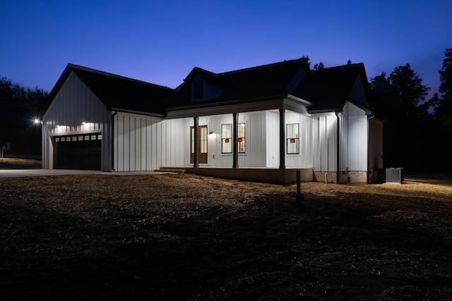 4100 Asbury Rd, Manchester, TN 37355 - view of front of property featuring board and batten siding, driveway, and a garage