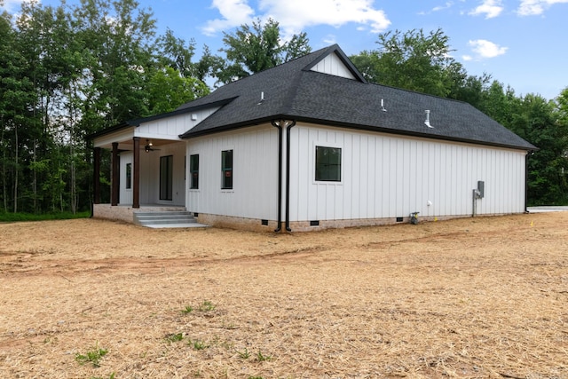 4100 Asbury Rd, Manchester, TN 37355 - view of front of house with crawl space, a shingled roof, a ceiling fan, and board and batten siding