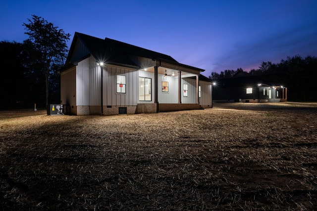 4100 Asbury Rd, Manchester, TN 37355 - property exterior at dusk featuring crawl space and board and batten siding