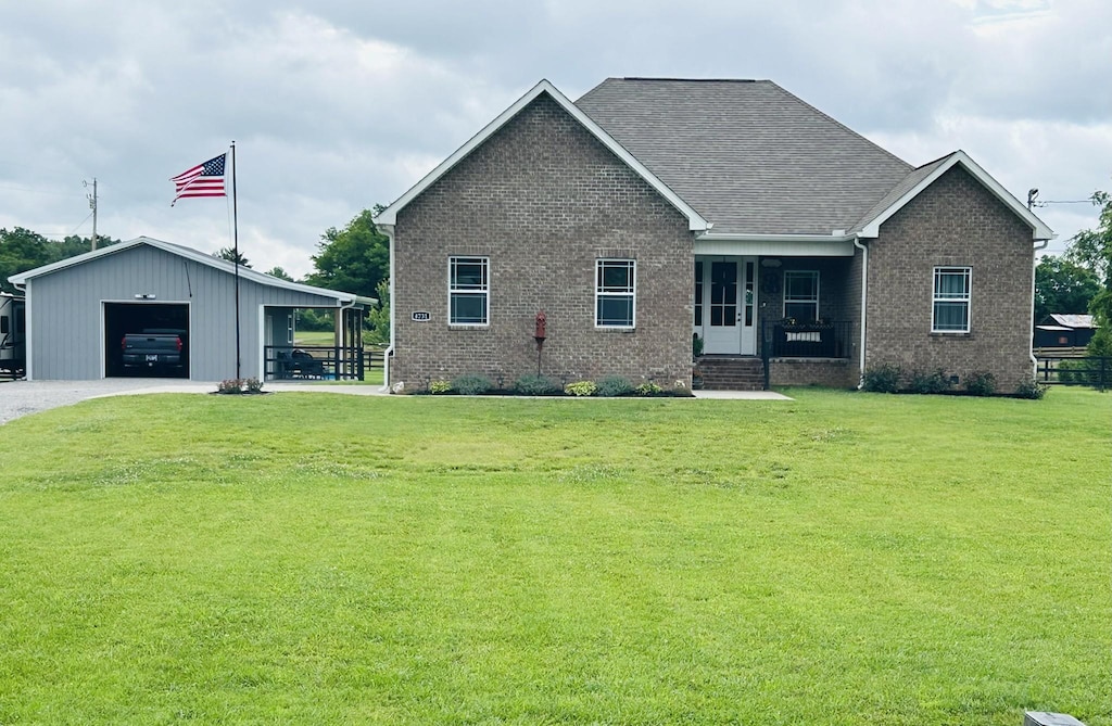 4731 Lunns Store Rd, Chapel Hill, TN 37034 - view of front of house featuring brick siding, a front lawn, an outbuilding, a garage, and driveway
