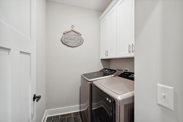 4731 Lunns Store Rd, Chapel Hill, TN 37034 - laundry area featuring washing machine and clothes dryer, cabinet space, and wood finished floors