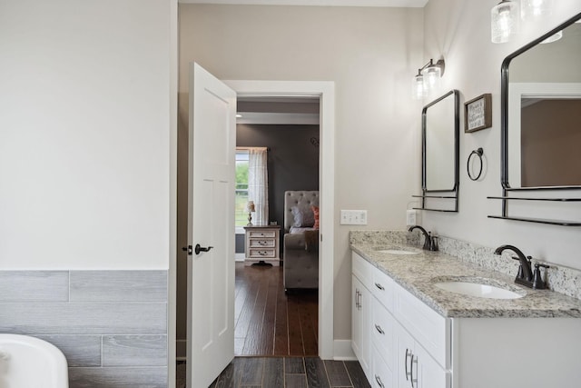 4731 Lunns Store Rd, Chapel Hill, TN 37034 - ensuite bathroom featuring double vanity, a soaking tub, and wood finished floors