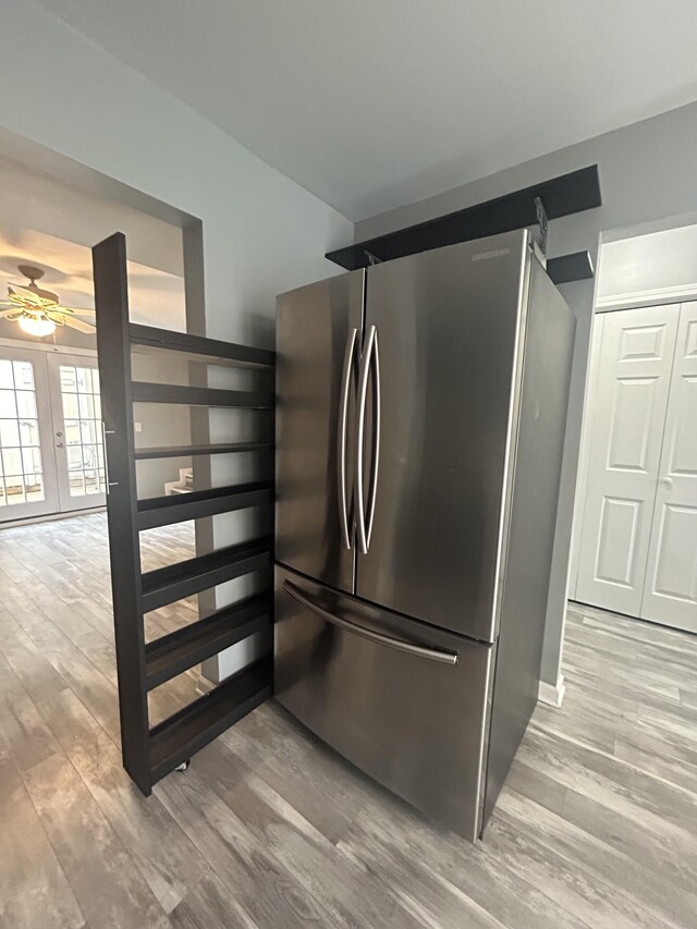 7206 Rosemary Ct, Fairview, TN 37062 - kitchen with freestanding refrigerator, light wood-style flooring, ceiling fan, and french doors