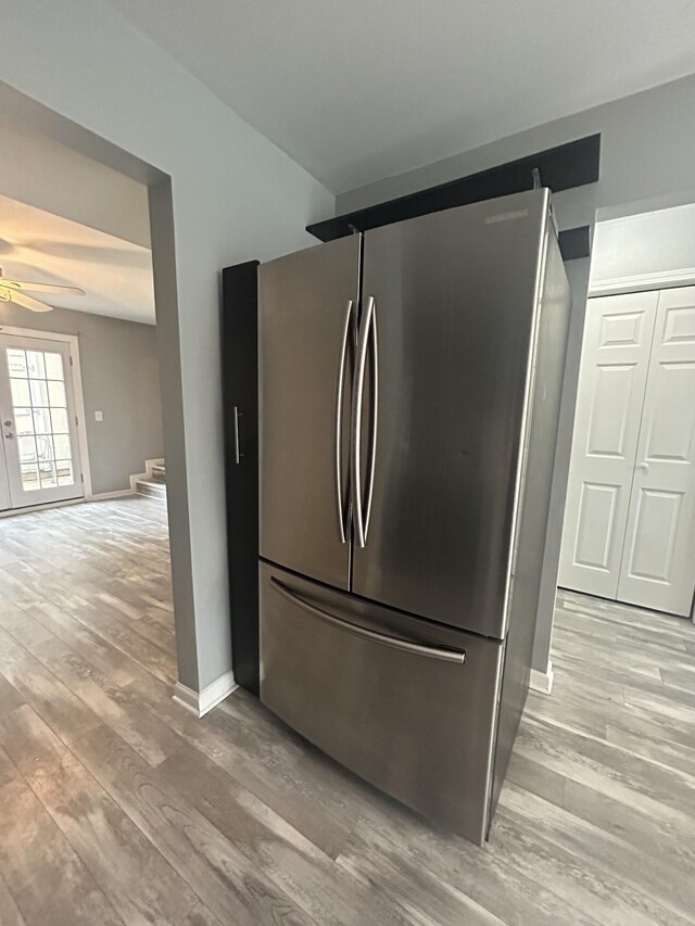 7206 Rosemary Ct, Fairview, TN 37062 - kitchen view of freestanding refrigerator, ceiling fan, and light wood-style floors