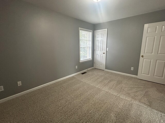 7206 Rosemary Ct, Fairview, TN 37062 - spare room featuring baseboards and light carpet